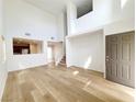 Bright living room boasts hardwood floors and abundant natural light at 7863 Warwickshire Way, Las Vegas, NV 89139