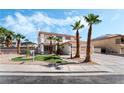 Charming two-story home with desert landscaping and mature palm trees at 8320 Deer Springs Way, Las Vegas, NV 89149