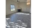 Bright living room with a fireplace, a large window, and tile floors providing ample natural light at 8985 S Durango Dr # 1154, Las Vegas, NV 89113