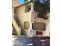 Tan apartment complex with covered balconies and stair access to each level at , Las Vegas, NV 89108