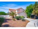 Charming two-story home with a tile roof, desert landscaping, and a two car garage at 1011 Pearl Marble Ave, North Las Vegas, NV 89081