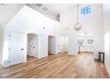 Bright and airy living room with high ceilings, hardwood floors, and an open floor plan at 1011 Pearl Marble Ave, North Las Vegas, NV 89081
