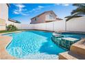 Sparkling pool and spa with tiled accents, surrounded by a white fence at 1011 Pearl Marble Ave, North Las Vegas, NV 89081