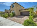Charming two-story home with a two car garage and paved driveway at 10271 Bark Pine Ct, Las Vegas, NV 89166