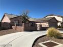 A charming single-story home featuring a well-maintained yard, complemented by a spacious driveway at 1083 Sterling Peak St, Las Vegas, NV 89110