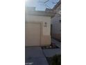 Home featuring a two-car garage, desert-style landscaping and visible address at 1423 Orange Jubilee Rd, Henderson, NV 89014