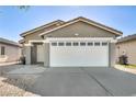 Inviting single-story home with a well-maintained front yard and attached two-car garage at 1714 Ringe Ln, Las Vegas, NV 89156