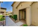 Inviting front entrance with a covered entryway and manicured landscaping at 172 Petaluma Valley Dr, Las Vegas, NV 89138