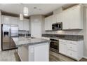 Modern kitchen featuring granite countertops and stainless steel appliances at 172 Petaluma Valley Dr, Las Vegas, NV 89138