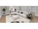 Bright living room featuring a comfortable white sectional sofa, neutral tones, and modern decor at 2112 Santa Ynez Dr, Las Vegas, NV 89104