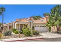 Well-maintained single-story home with a tile roof and desert landscaping at 2753 Port Of Call Dr, Las Vegas, NV 89128
