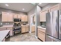 Well-lit kitchen with stainless steel appliances, double oven, and ample cabinet space at 2810 Somerset Springs Dr, Henderson, NV 89052