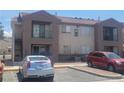 Two-story apartment complex featuring a balcony and assigned parking spaces at 3965 Rebecca Raiter Ave # 201, Las Vegas, NV 89110