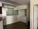 Laundry area featuring a mirrored wall, washer, and dryer at 5170 S Jones Blvd # 108, Las Vegas, NV 89118