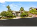 Beautiful exterior elevation showing the front yard and unique architectural details at 584 Saint Croix St, Henderson, NV 89012
