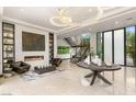 Spacious living area with fireplace, custom built-ins, and natural light at 584 Saint Croix St, Henderson, NV 89012