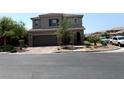 Beautiful two-story home featuring a neutral color scheme, tidy landscaping, and a two-car garage at 7861 Hamilton Pool Dr, Las Vegas, NV 89113
