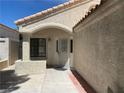 Covered entryway with security door and textured stucco walls at 8432 Apple Hill Ct, Las Vegas, NV 89128