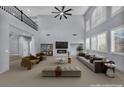 Spacious living room boasting large windows, fireplace, and modern decor at 8809 Barium Rock Ave, Las Vegas, NV 89143