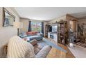 Bright living room with hardwood floors and entertainment center at 1150 N Buffalo Dr # 1007, Las Vegas, NV 89128