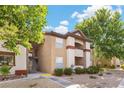 Exterior corner view of the home featuring stucco and stairway at 231 W Horizon Ridge Pkwy # 1228, Henderson, NV 89012