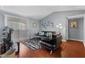 Cozy living room with hardwood floors, comfortable seating, and sliding glass door at 231 W Horizon Ridge Pkwy # 1228, Henderson, NV 89012