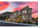 Contemporary two-story home featuring desert landscaping, stucco, and stone exterior at 2601 Nevada Agave Ln, Las Vegas, NV 89138