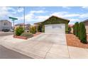 Inviting single-story home features a spacious driveway and charming landscaping at 3617 Walnut Wood St, Las Vegas, NV 89129