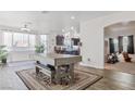 Open-concept living area with lots of natural light and wood flooring at 3632 Julia Waldene Ct, Las Vegas, NV 89129