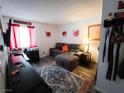 Cozy bedroom with laminate flooring, a comfortable couch and a small desk setup at 3771 Desert Marina Dr # 95, Laughlin, NV 89029