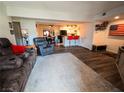 Open-concept living room with laminate floors, comfortable seating, and a view to the kitchen at 3771 Desert Marina Dr # 95, Laughlin, NV 89029