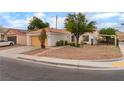 Single-story home with two-car garage, white walls, and minimalist landscaping at 4110 Bonita Desert Ct, North Las Vegas, NV 89032