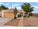 Well-maintained single-story home featuring an attached two-car garage and covered patio at 4110 Bonita Desert Ct, North Las Vegas, NV 89032