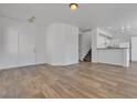 Bright and airy living space with hardwood flooring and staircase access at 4149 Dignified Ct, North Las Vegas, NV 89032