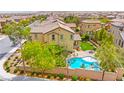 Spacious property featuring a pool, fire pit, and landscaped backyard, all in a vibrant community at 419 Vigo Port St, Las Vegas, NV 89138