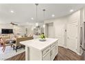 Bright kitchen featuring a large island with modern pendant lighting and stainless steel appliances at 419 Vigo Port St, Las Vegas, NV 89138
