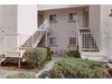Condominium complex featuring well-maintained landscaping and multiple access stairways at 4555 E Sahara Ave # 280, Las Vegas, NV 89104