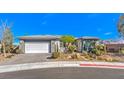 Charming single-story home featuring desert landscaping, a two-car garage, and a paved driveway at 4924 E Cactus Canyon Dr, Pahrump, NV 89061