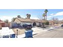 Pleasant single-story home, featuring a two-car garage and well-maintained landscaping at 5175 Palmyra Ave, Las Vegas, NV 89146