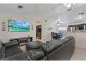 Spacious living room boasts tile flooring and a cozy fireplace beneath a large flat-screen TV at 5184 Mineral Lake Dr, Las Vegas, NV 89122