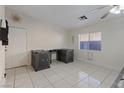 Versatile room with tile flooring and a window providing natural light at 5184 Mineral Lake Dr, Las Vegas, NV 89122