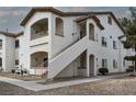 A multi-level condo with stucco walls, outdoor stairway access, and neat landscaping at 5650 E Sahara Ave # 2062, Las Vegas, NV 89142