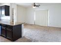 Bright living room featuring neutral carpet and a sliding glass door for natural light at 5650 E Sahara Ave # 2062, Las Vegas, NV 89142