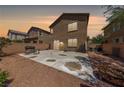 Cozy backyard with a concrete patio and barbecue, perfect for outdoor gatherings and relaxation at 6409 Dundock Ave, Las Vegas, NV 89122