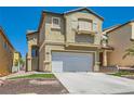 Lovely two-story residence showcasing a well-kept lawn and an attached two-car garage at 6424 Strongbow Dr, Las Vegas, NV 89156