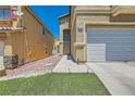 Attractive two-story home featuring a well-maintained lawn and two car garage at 6424 Strongbow Dr, Las Vegas, NV 89156