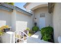 Inviting entryway featuring a decorative gate and a well-maintained walkway at 7500 Peaceful Brook St, Las Vegas, NV 89131