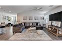 Spacious living room with a comfortable sectional sofa and stylish decor at 8164 Golden Cholla Ave, Las Vegas, NV 89179