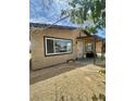 Charming single-story home with a covered porch and well-maintained landscaping at 851 W Carey Ave, North Las Vegas, NV 89030
