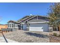 Charming single-story home with a two-car garage and beautifully paved driveway at 1048 Forrest Falcon Dr, Henderson, NV 89011